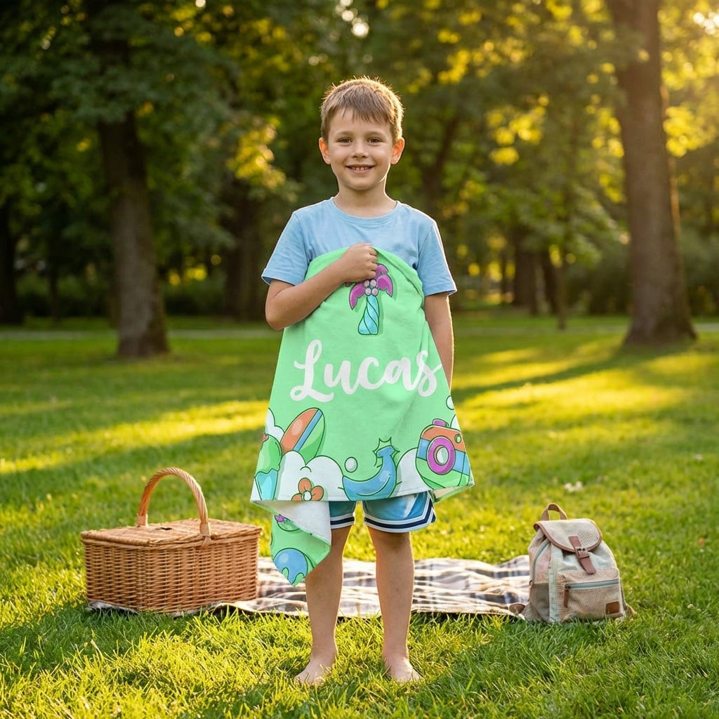 Child wearing personalised kids towel with name outdoors, quick dry lightweight children towel