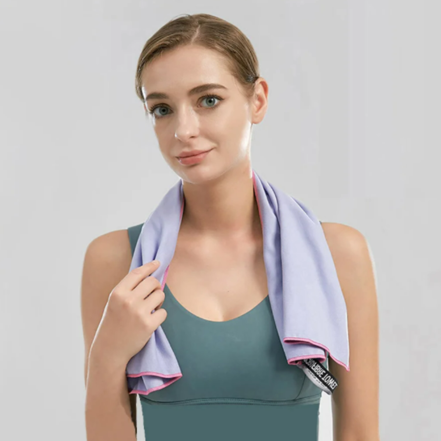 Woman with microfibre towel around neck, compact quick dry sports towel for gym use