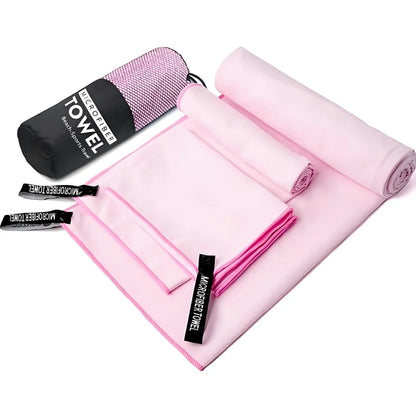 Complete 3-piece Light Pink microfibre towel set laid flat, showing all three sizes and the matching carry bag.