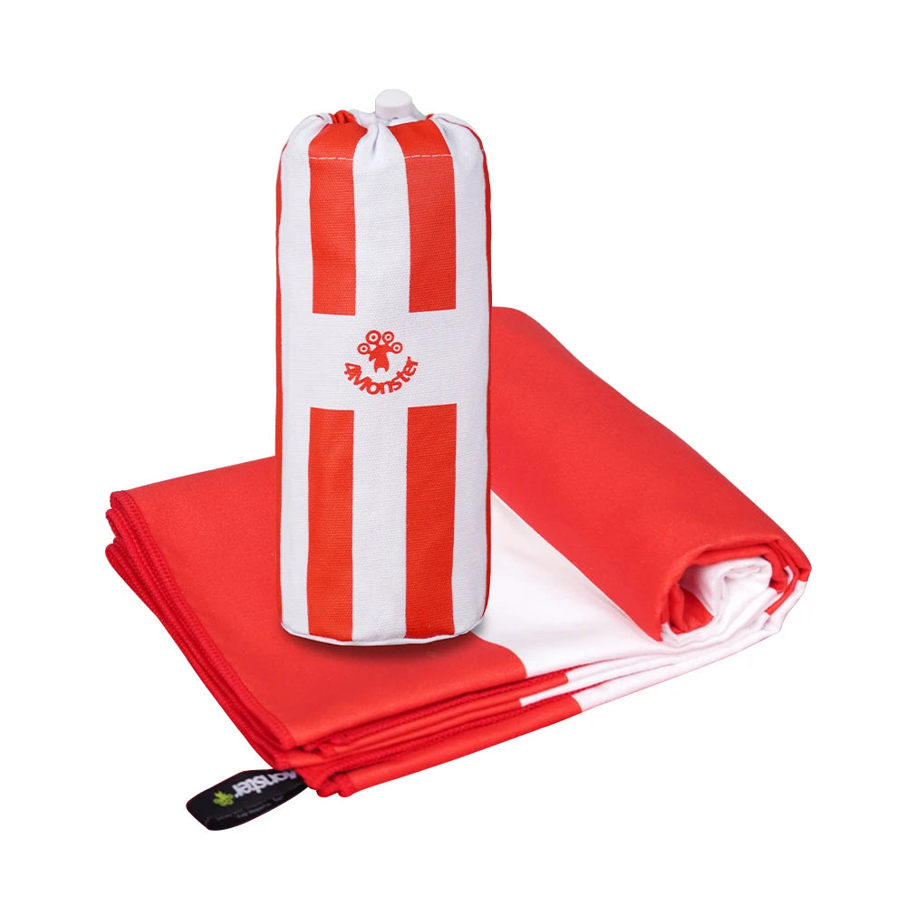 red striped beach towel folded with strap beach towel