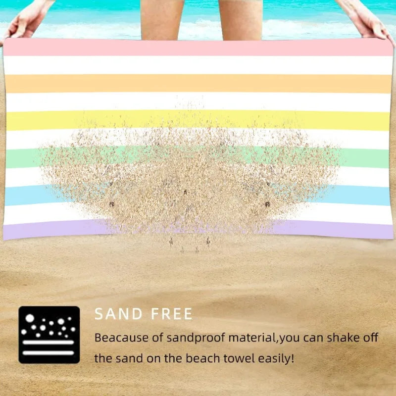 Sand sliding off striped microfibre beach towel surface, sand resistant quick dry towel