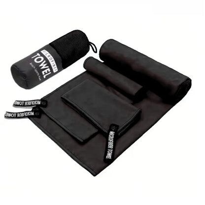 Complete 3-piece Black microfibre towel set laid flat, showing all three sizes and the matching carry bag.