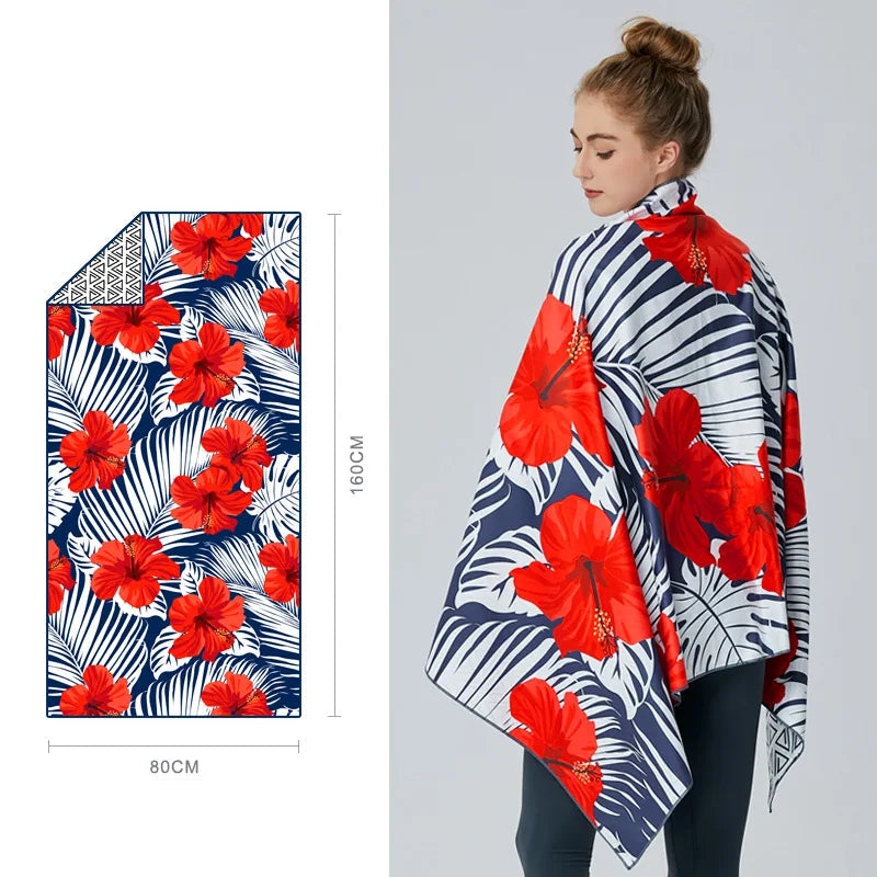 woman wrapped in red tropical velvet microfibre towel beach use
