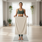 Woman holding large microfibre towel at home showing full size coverage, quick dry towel